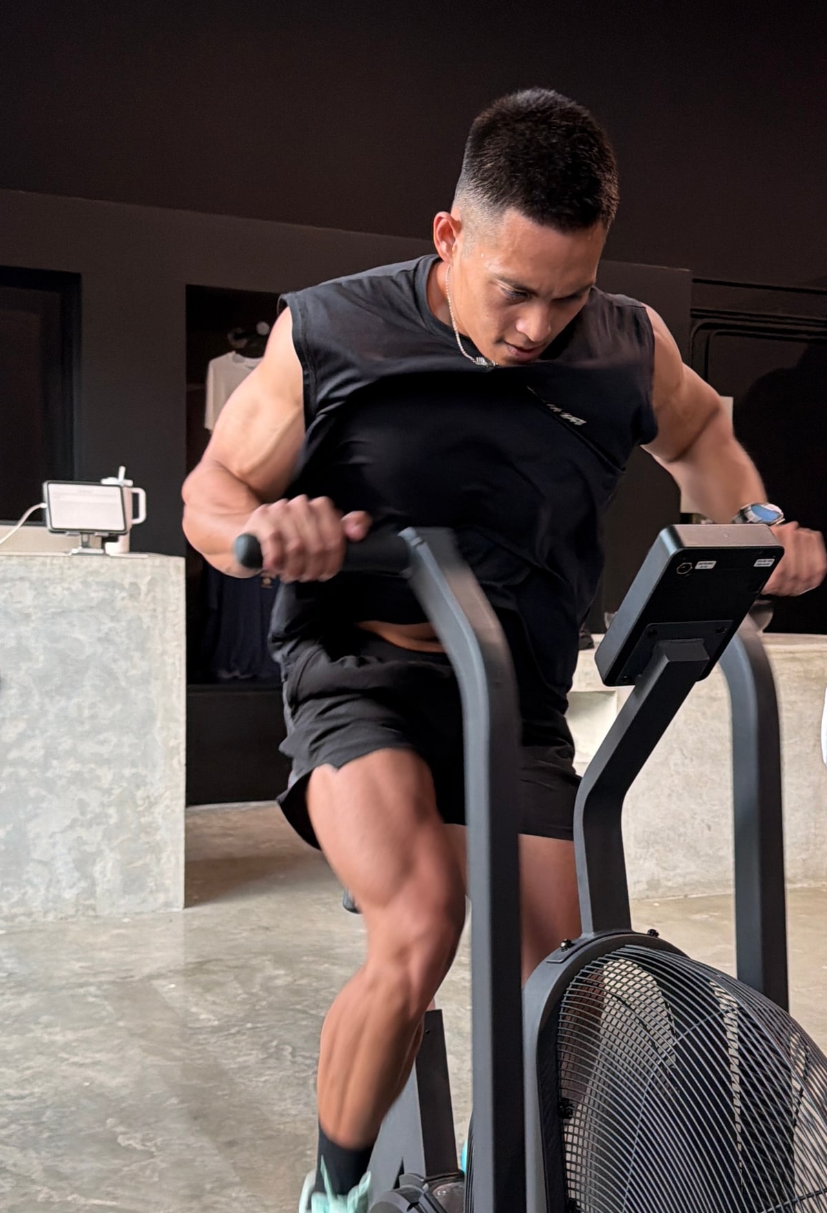 Jeff Lumapas training on an air bike